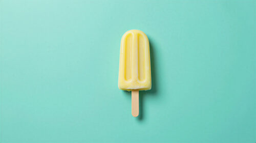 Minimalist Yellow Popsicle on Pastel Mint Background PC Wallpaper