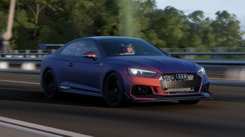 Custom Audi RS5 Coupe with Iridescent Paint Job Driving on Highway 4K Desktop Wallpaper