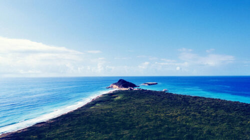 Breathtaking Coastal Island Peninsula with Turquoise Ocean Waters 4K Wallpaper