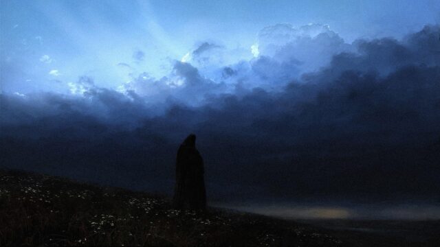 Solitary Cloaked Figure Standing Under Stormy Blue Clouds Desktop Wallpaper