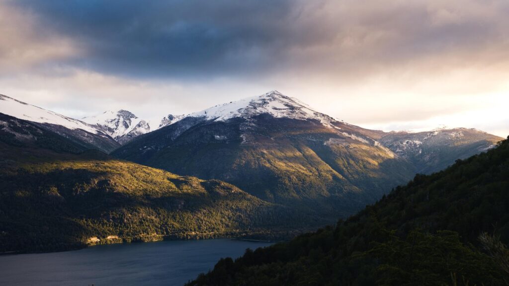 Majestic Snowy Peaks Over Alpine Lake Landscape 4K Wallpaper