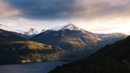 Majestic Snowy Peaks Over Alpine Lake Landscape 4K Wallpaper