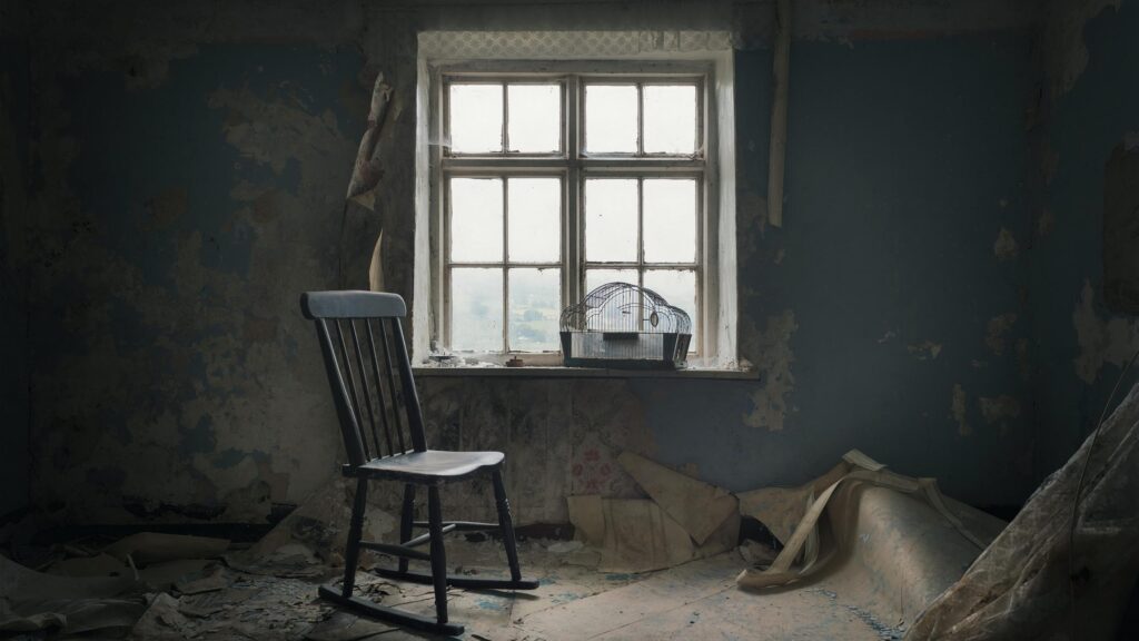 Abandoned Room with Old Rocking Chair and Birdcage 4K Desktop Wallpaper