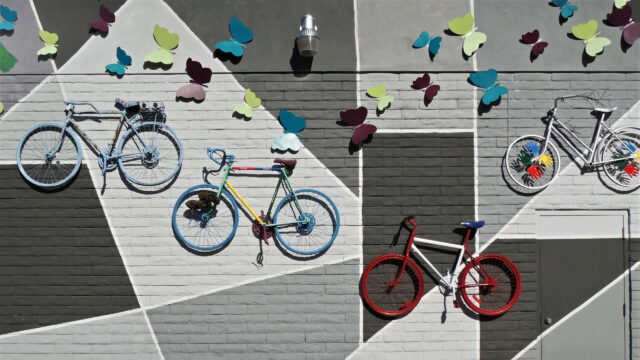 Vibrant Bicycles and Colorful Butterflies Mural Urban Art Desktop Wallpaper