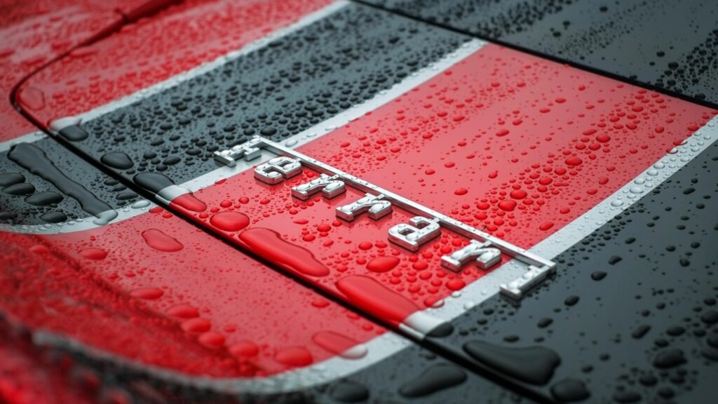 Ferrari Emblem Close-Up with Raindrops on Racing Livery Desktop Wallpaper