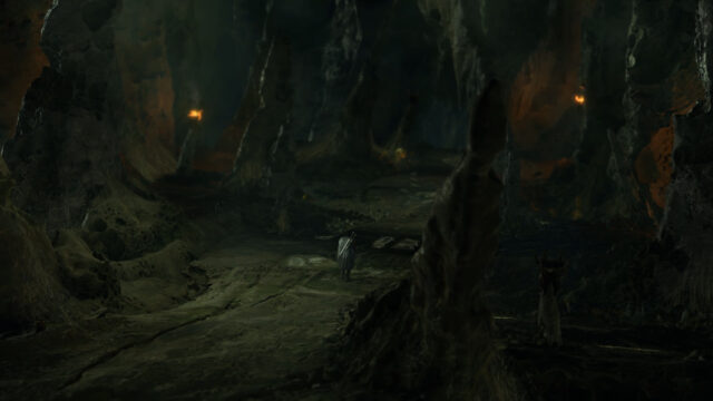 Lone Warrior Exploring a Dark Eerie Cave Fantasy 4K Desktop Wallpaper