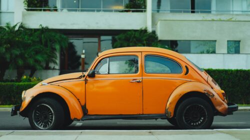 Vintage Orange Volkswagen Beetle Side View Desktop Wallpaper