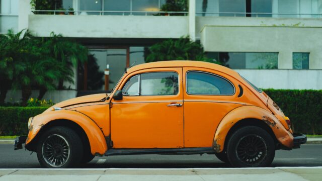 Vintage Orange Volkswagen Beetle Side View Desktop Wallpaper