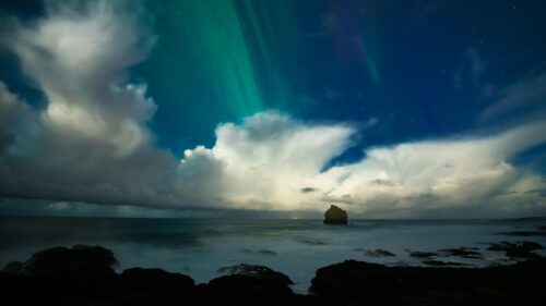 Stunning Aurora Borealis Over Icelandic Seascape 4K Wallpaper