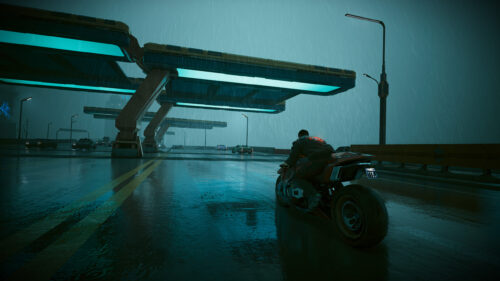 Cyberpunk Biker Riding in Night City Rain 4K Desktop Wallpaper