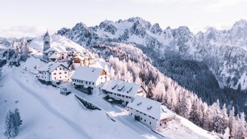Stunning Snowy Mountain Village Landscape with Church 4K Wallpaper