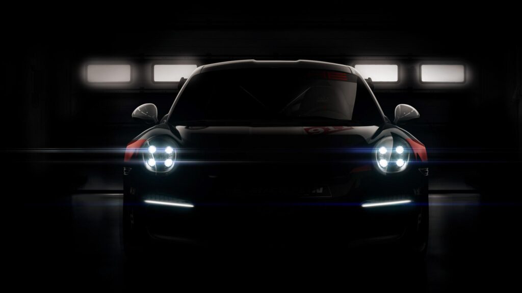 Minimalist Porsche 911 RSR Front View in Dark Garage 4K Desktop Wallpaper