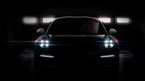 Minimalist Porsche 911 RSR Front View in Dark Garage 4K Desktop Wallpaper