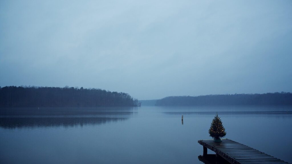 Minimalist Christmas Tree on Lake Dock Moody Winter Landscape 4K Wallpaper