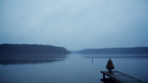 Minimalist Christmas Tree on Lake Dock Moody Winter Landscape 4K Wallpaper