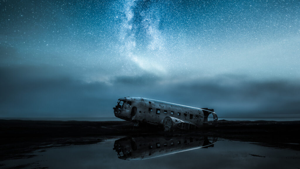 Abandoned Plane Wreckage Under Milky Way Night Sky Desktop Wallpaper