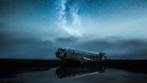 Abandoned Plane Wreckage Under Milky Way Night Sky Desktop Wallpaper