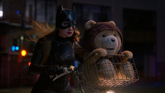 Catwoman Cycling with Teddy Bear in Cosplay 4K Desktop Wallpaper
