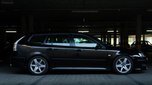 Sleek Black Saab 9-3 SportCombi Station Wagon Side View Desktop Wallpaper