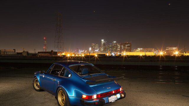 Stunning Blue Porsche 911 Turbo at Night with City Skyline Desktop Wallpaper