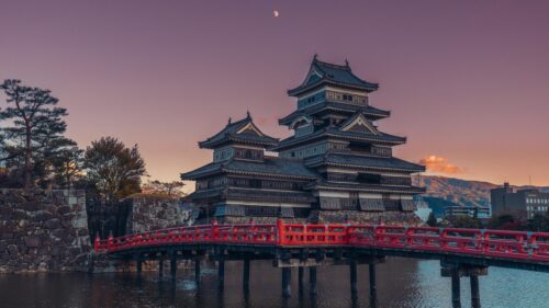 Stunning Matsumoto Castle Sunset and Traditional Red Bridge 4K Desktop Wallpaper