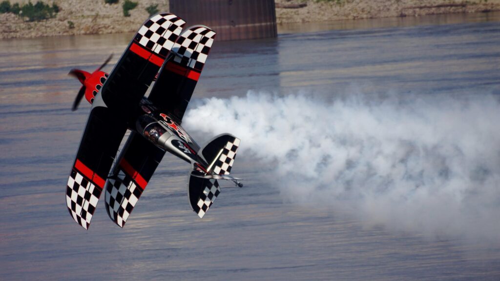 Stunning Acrobatic Biplane in Flight with Smoke Trails 4K Desktop Wallpaper