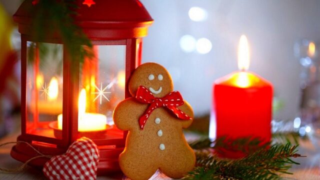 Cozy Christmas Gingerbread Man with Red Lantern and Candle 4K Desktop Wallpaper