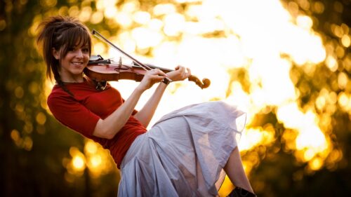 Enchanting Violinist in Golden Sunset Light Desktop Wallpaper