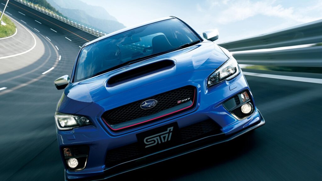 Subaru WRX STI S207 Racing on Scenic Mountain Road 4K Desktop Wallpaper