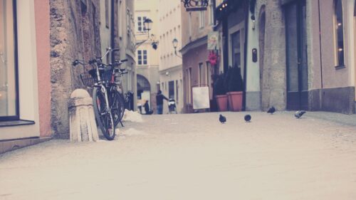 Charming European Cobblestone Street with Bicycles Desktop Wallpaper