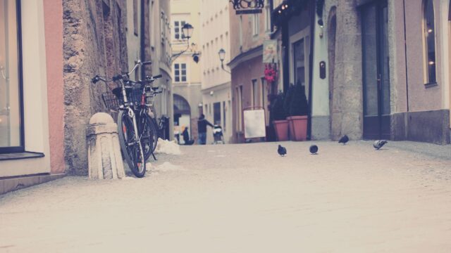 Charming European Cobblestone Street with Bicycles Desktop Wallpaper