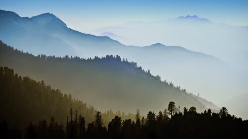 Breathtaking Misty Mountain Layers Serene Nature 4K Wallpaper