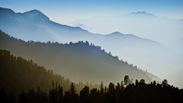 Breathtaking Misty Mountain Layers Serene Nature 4K Wallpaper