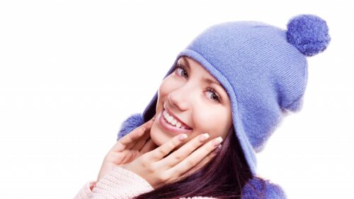 Smiling Young Woman in Cozy Purple Winter Hat 4K Desktop Wallpaper