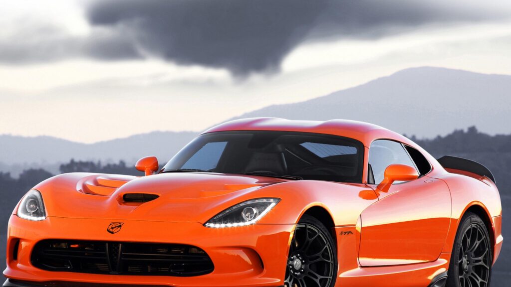 Bright Orange Dodge Viper TA Sports Car in Scenic Sunset 4K Desktop Wallpaper