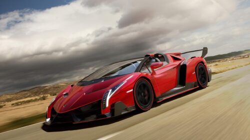 Stunning Red Lamborghini Veneno Roadster Driving Fast 4K Wallpaper
