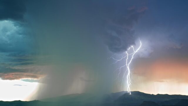 Dramatic Lightning Strike Over Mountain Range Storm 4K Wallpaper