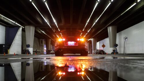 Red Toyota Supra MK4 Under Urban Bridge Night Lights 4K Wallpaper