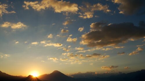 Breathtaking Golden Hour Mountain Sunset Over Tranquil Landscape 4K Wallpaper