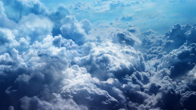 Stunning Aerial View of Majestic Fluffy Clouds in Deep Blue Sky 4K Wallpaper