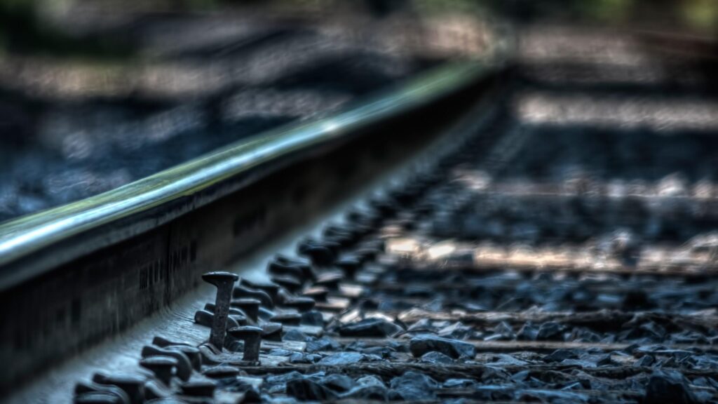 Macro View of Railway Tracks and Spikes Desktop Wallpaper