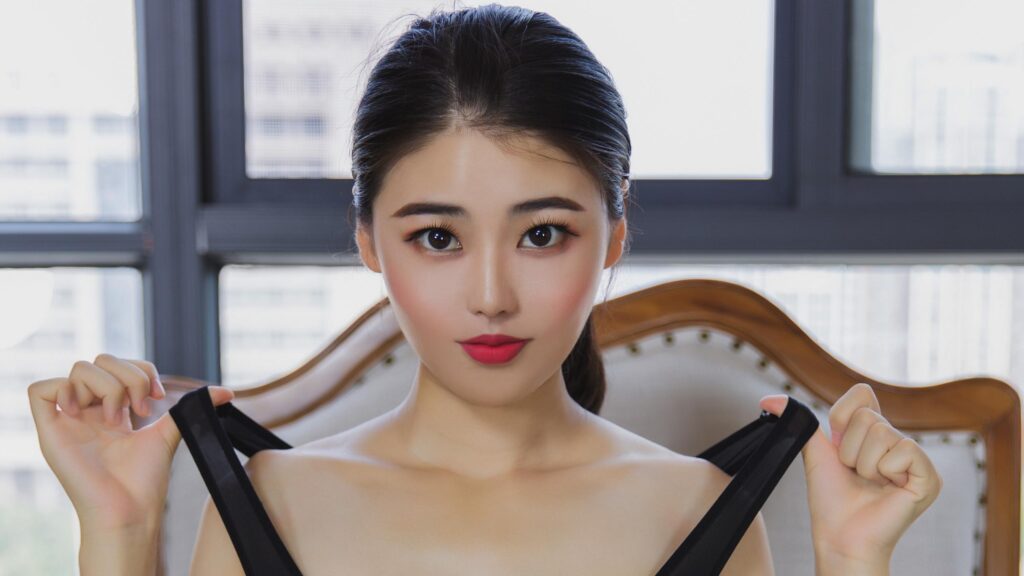Elegant Young Woman in Black Dress Indoor Portrait 4K Desktop Wallpaper
