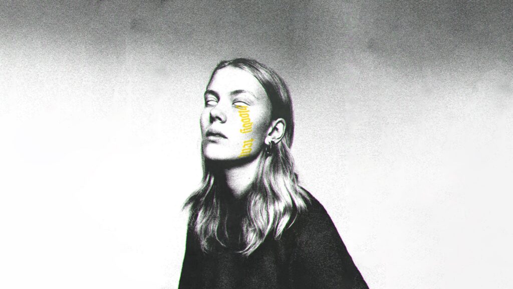 Eerie Portrait of a Woman with Yellow Text Overlay High Resolution Desktop Wallpaper