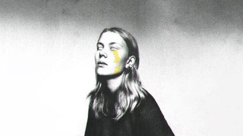 Eerie Portrait of a Woman with Yellow Text Overlay High Resolution Desktop Wallpaper