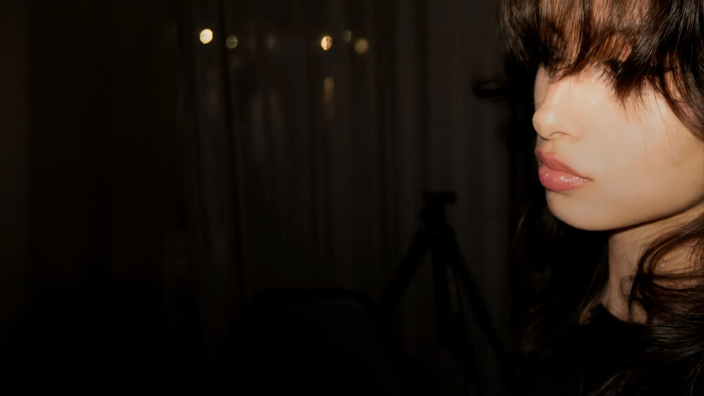 Minimalist Portrait of a Woman in Low Light Setting 4K Desktop Wallpaper