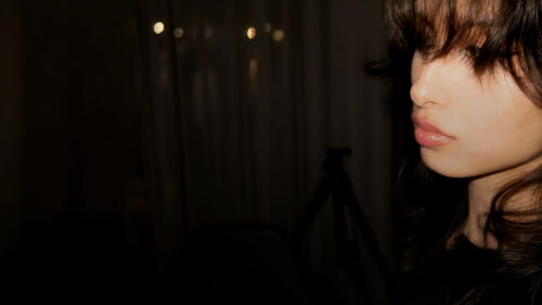 Minimalist Portrait of a Woman in Low Light Setting 4K Desktop Wallpaper