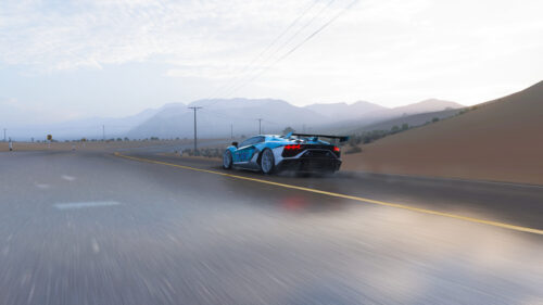 Blue Lamborghini Aventador SVJ Drifting on Desert Road 4K Desktop Wallpaper