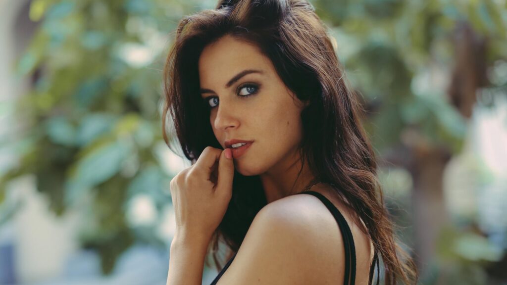Stunning Brunette Woman with Intense Blue Eyes Cinematic Portrait Desktop Wallpaper