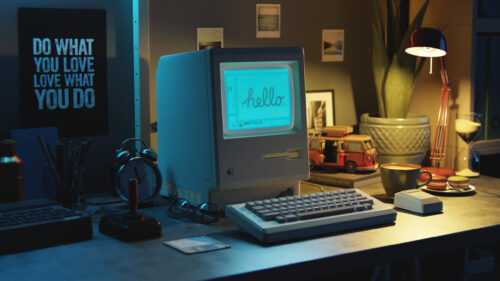 Vintage Macintosh Desktop Setup with Hello Screen 4K Wallpaper