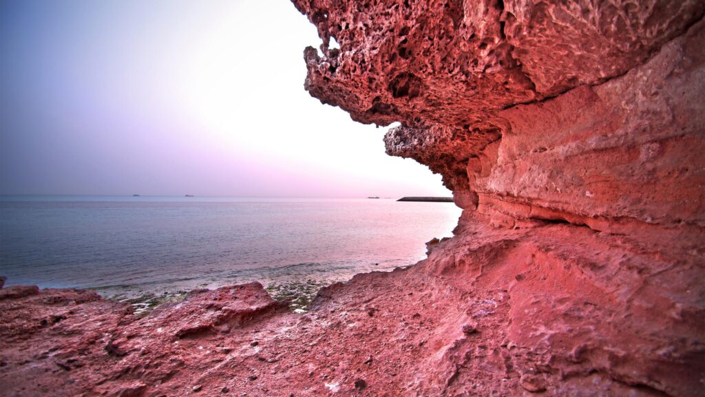 Stunning Pink Coastal Cliff at Sunset 4K Desktop Wallpaper